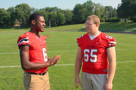 DeJuan McKenny '15 and Eric McDonald '15 discuss strategy for tonight's game against Cedar Falls