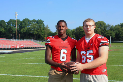 DeJuan McKenny '15 and Eric McDonald '15 pose on Bates Field the morning before the Cedar Falls game