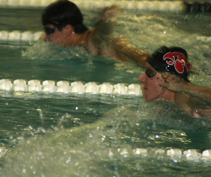 Ben Weideman takes a breath on his way to second place in the 100 fly finishing with a time of 55.8.