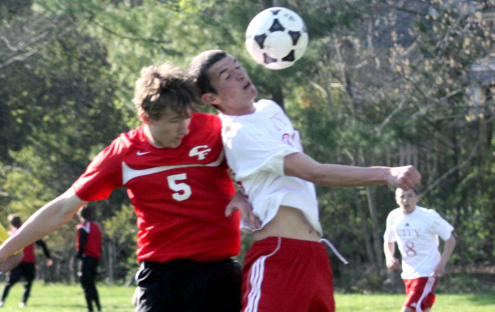 Will Benson 11 midfielder and a Little Hawk sports reporter takes a ball to the face in a 5-2 victory over Cedar Falls. Photo by Sam Buatti
