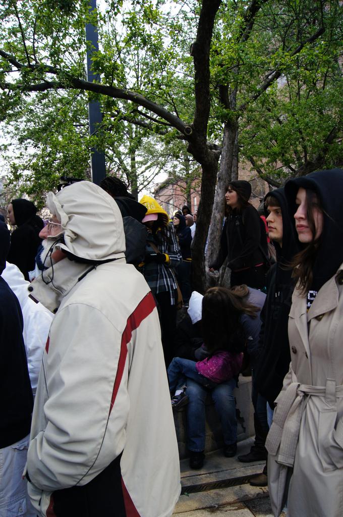 People watch as people speak at the Trayvon Martin rally Monday. Photo by Eli Shepherd