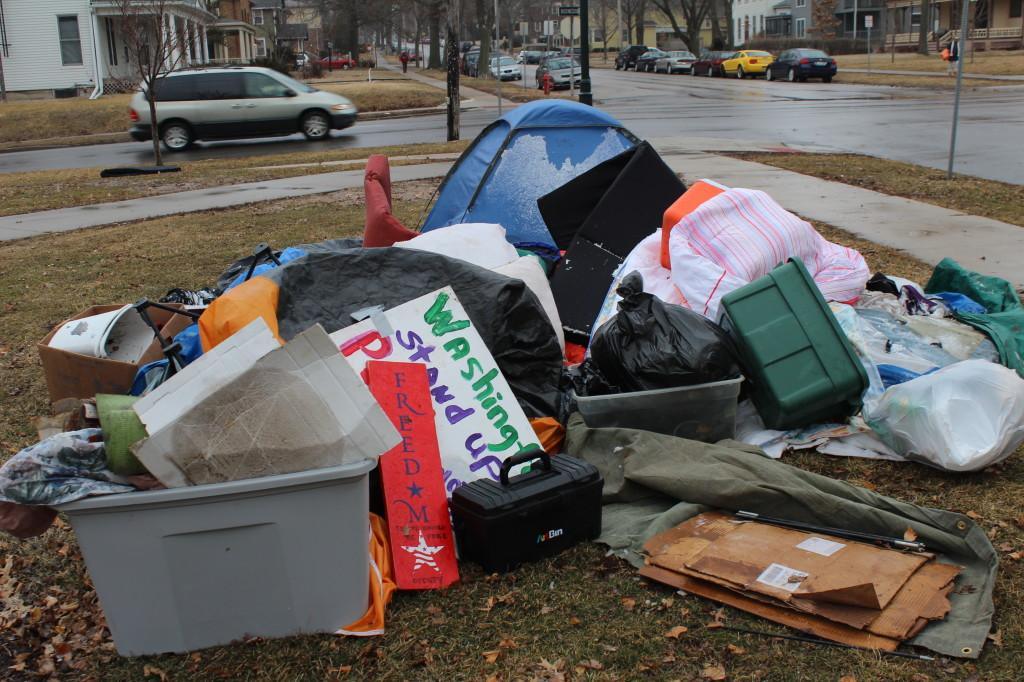 Remnants of the occupiers sit in College Green Park in Iowa City. Photo by Kieran Green.