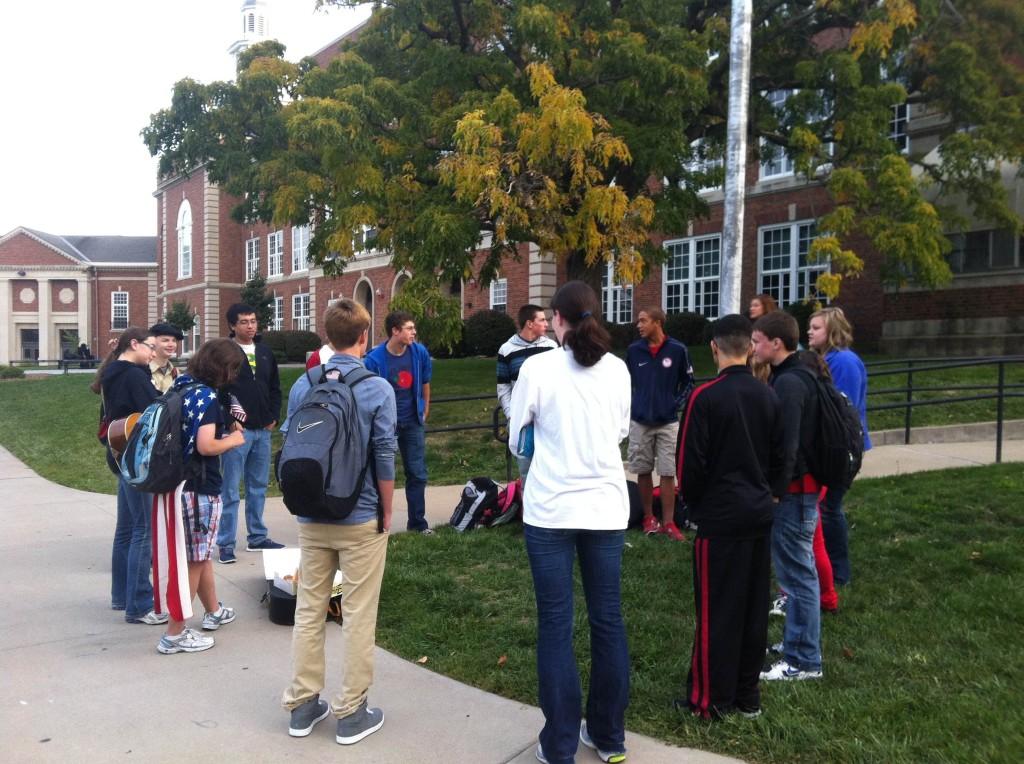 Students gather at the flag pole outside of City High.  Photo By Christian Kennedy
