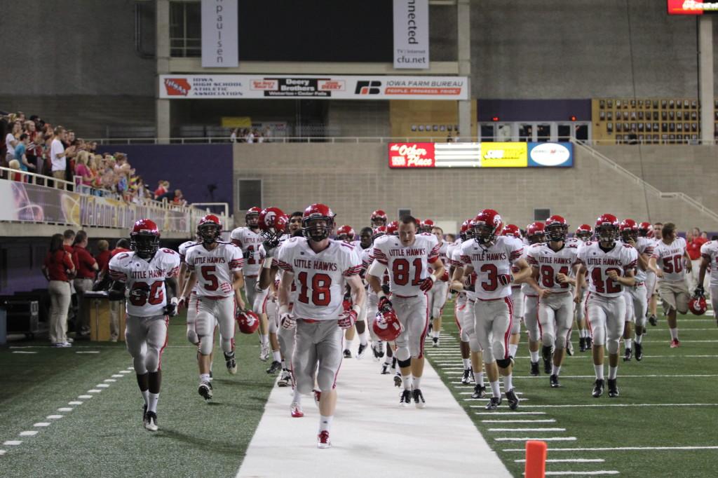 The Little Hawks jog off the field at the UNI Dome
