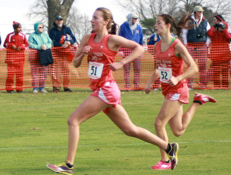 Lindsey Bruns 13 and Ellen Carman 14 run for the finish line at the state meet on Saturday.  Photo by Oli Peters