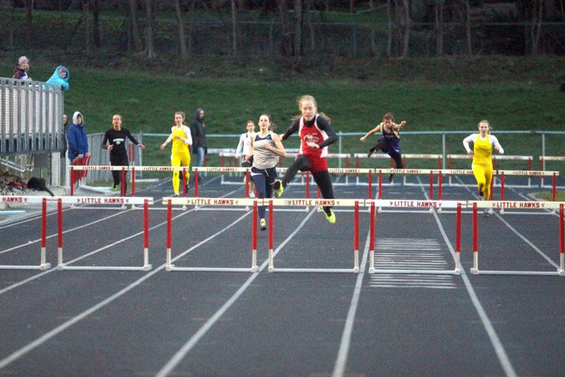 Sarah+Plock+15+jumps+a+hurdle+in+the+final+leg+of+the+400+hurdles+on+Thursday.++Photo+by+Ryan+Young