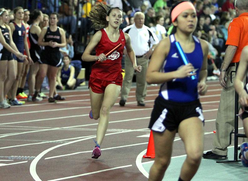 Olivia Parrott 16 runs during the teams first indoor home meet.  Photo by Annika Wasson