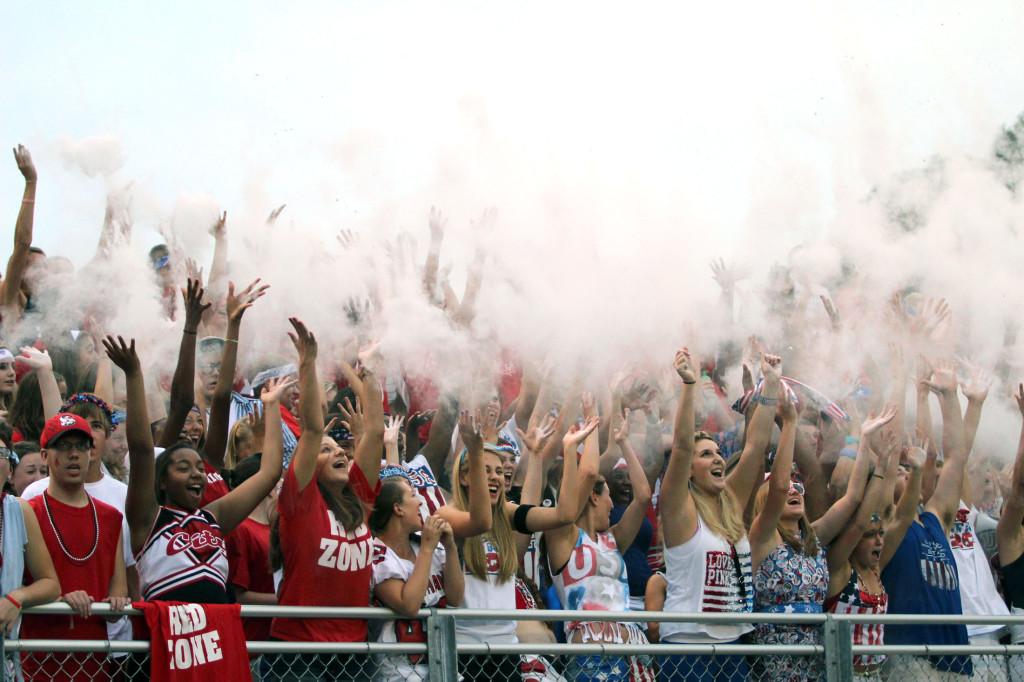 Students toss flour during the kick off of the 2012 football season opener.  Photo by Kierra Zapf