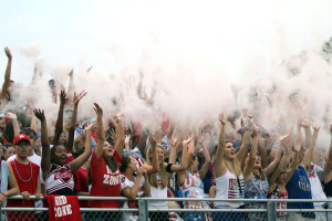 Students toss flour during the kick off of the 2012 football season opener.  Photo by Kierra Zapf