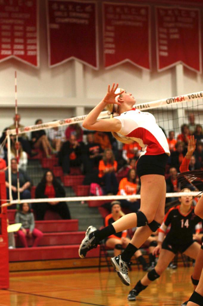 Rylee Price 15 goes up for an attack in the Little Hawks first round match against CR Prairie.  Photo by Cora Bern-Klug