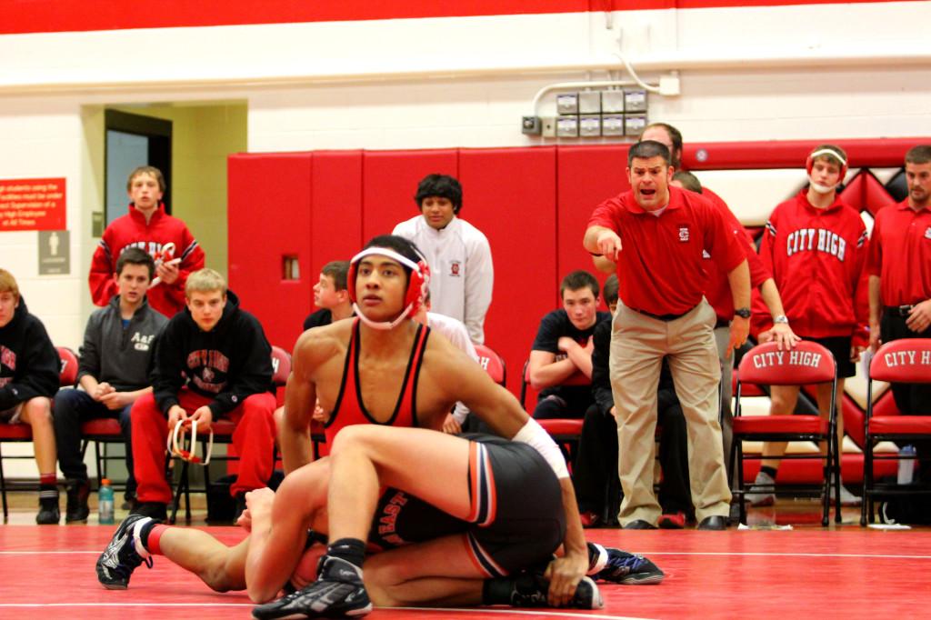 Ali Omar works his opponent in the home wrestling opener. Photo by Nathan Katalinich