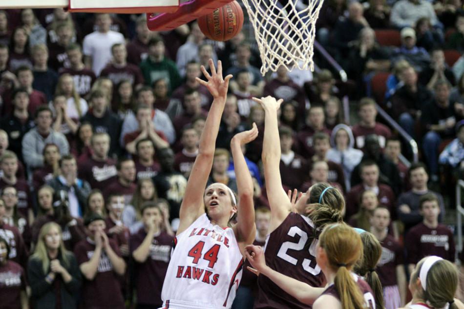 Haley Lorenzen 14 shoots over a Dowling defender in the state semi-final.  Photo by Cora Bern-Klug