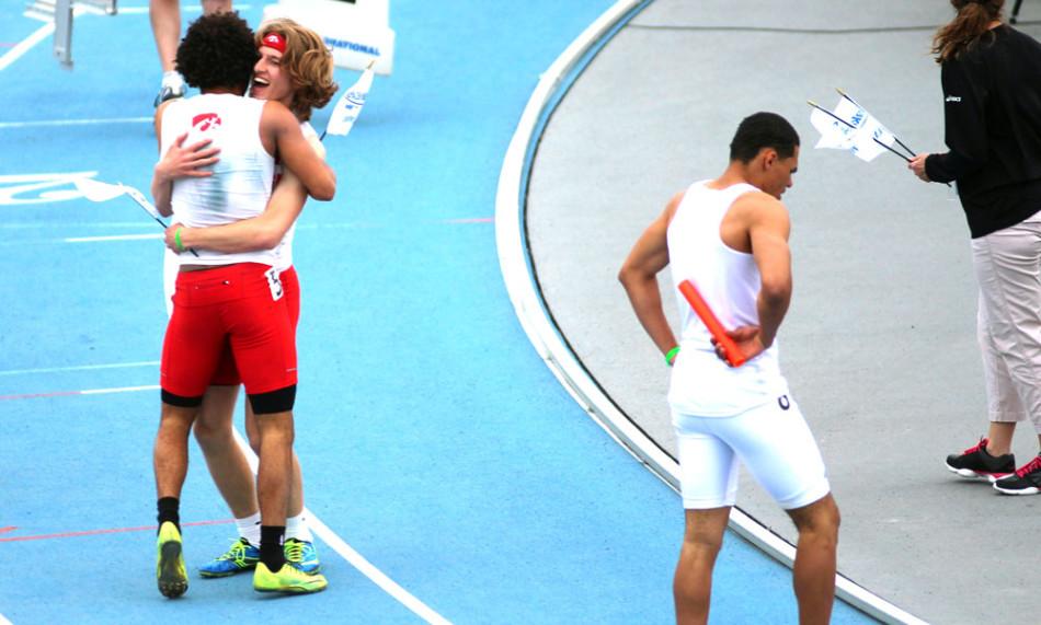 Hugging after their 4x100 victory.