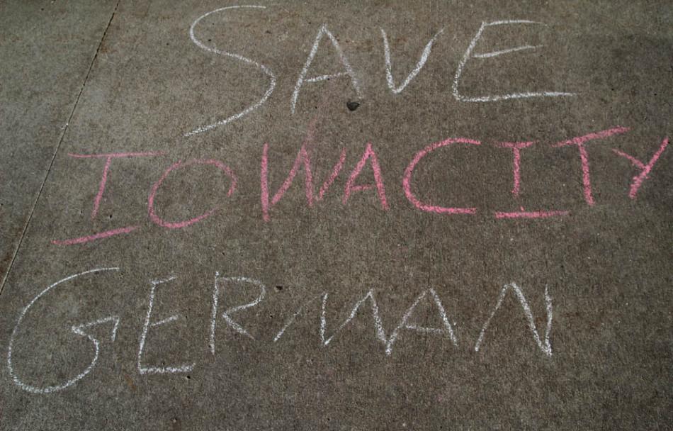 City High students have chalked sidewalk on campus in protest of the announcement that the German language program will be phased out of the ICCSDs class offerings.