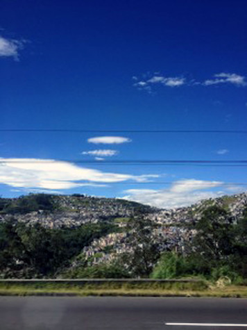On the bus ride to the Paramo (our first stop) we drove through Quito, Ecuador's capitol. The colorful houses creeped up the hills and mountains of Quito. The sky was a beautiful shade of blue and I couldn't help myself taking this photo from the bus window.