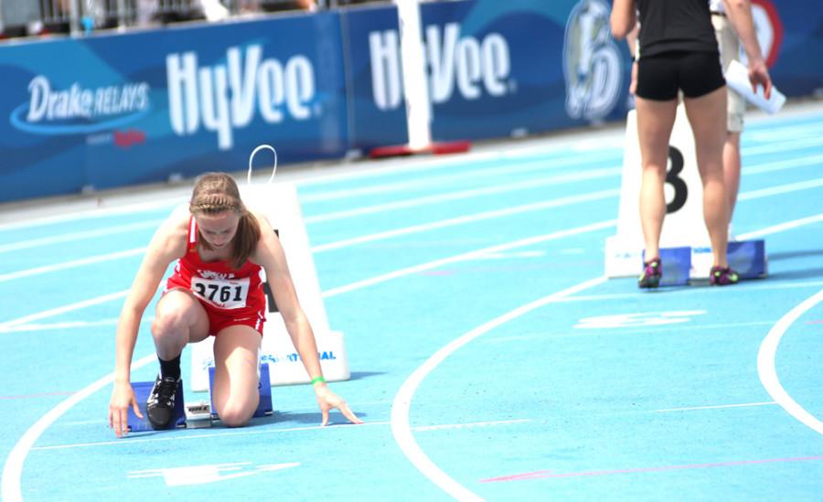 Sarah Plock '15  in the starting block at the Drake Relays. 