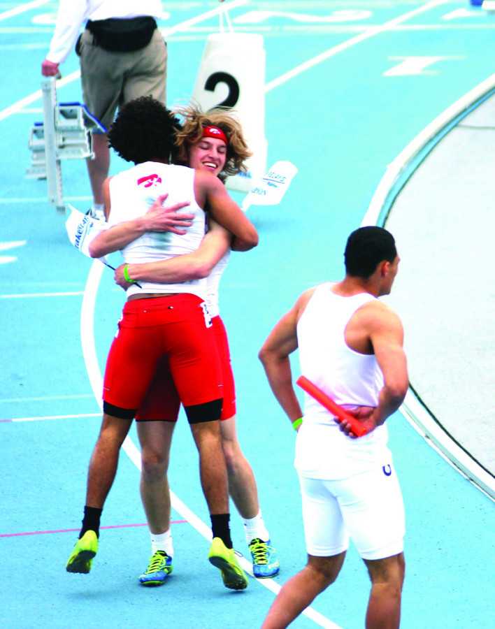 Bryson Runge '15 and Kole Butler '14 celebrate after winning their race at Drake. 