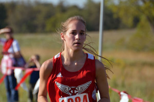 Megan Plock '15 crosses the finish line