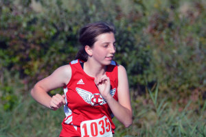 Claire Kelly '18 pushes up a hill at the Little Hawk Invitational