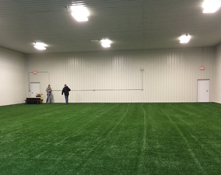 Indoor preview of the new hitting facility at City High. Workers are laying down turf at this point. 