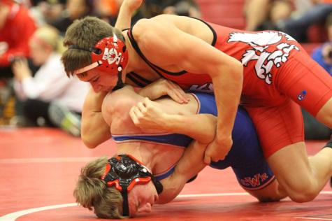 Colton Chalupa '15 takes control over a Washington opponent. Chalupa won his match against Cedar Falls at weight 138 with a fall in just over a minute.