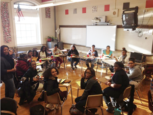 Club members sit in a circle to eat and chat