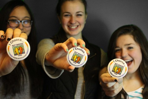 Arielle Somadi '15, Maggie Morony '15, and Katrina Scandrett '15 proudly show off their buttons.