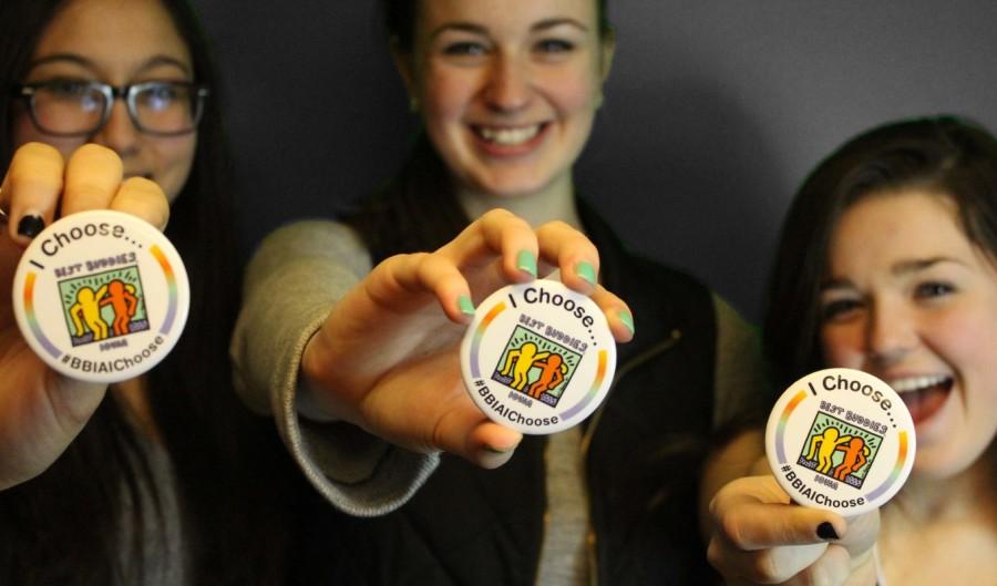 Arielle Somadi 15, Maggie Morony 15, and Katrina Scandrett 15 proudly show off their buttons.