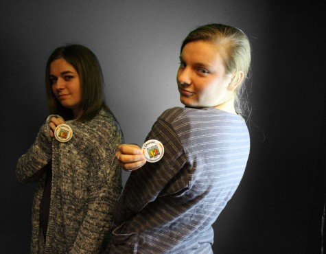 Oliva Peterson '15 and Estie Dillard '17 show off their buttons, they choose not to use the R-word in their everyday conversations.