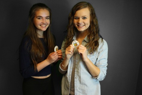 Sofie Lie '17 and Sadie Hobbs '17 show off their buttons right after they signed the pledge for Spread the Word to End the Word day.