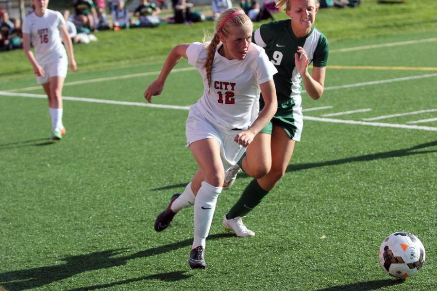 Maddie Deprenger 16 drives up the side of the field against Hempstead.