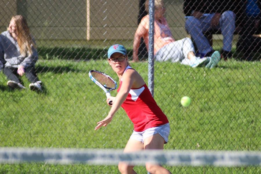 Eve Small 15 winds up a hard forehand against her opponent during Tuesdays match.