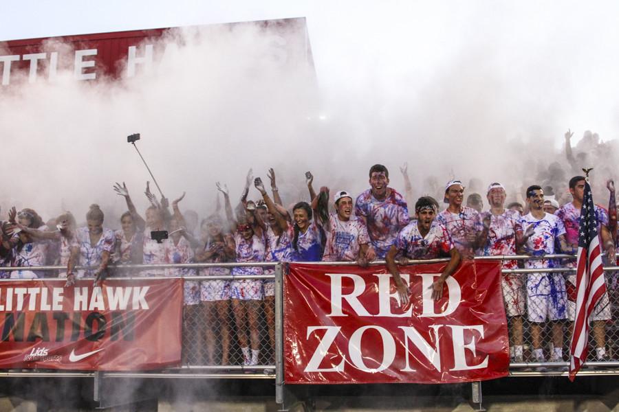 The student section throws up white powder after kickoff.