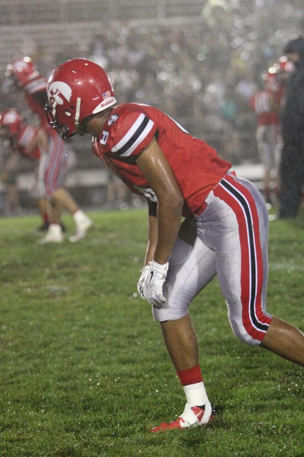 Wide receiver Jason Jones 16 in his stance during the City vs West game. 