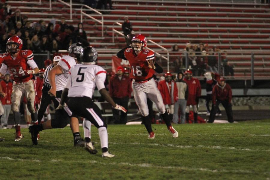 Jared Taylor 17 throws a pass in the first half at Bates Field in the first round playoff game against Linn-Mar. 