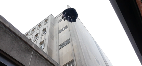 Ronnie McDowell performing a gap jump in downtown Iowa City. WARNING: stunts performed by a trained professional.