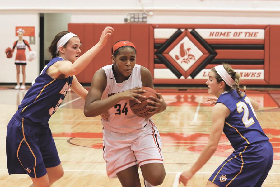 Kenya Earl 17 drives to the basket against Dubuque Wahlert December 8th. 