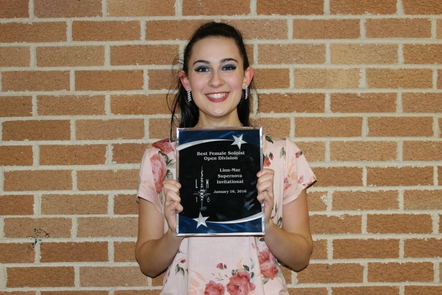 Addie Bass holds her award for best female soloist.