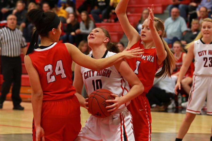 Ashley Joens 18 gets fouled under the hoop by Ottumwa on February 20th.