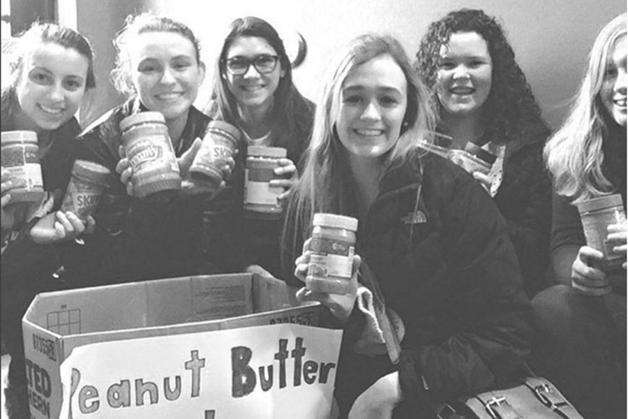 ICCI members with the peanut butter donations they collected.