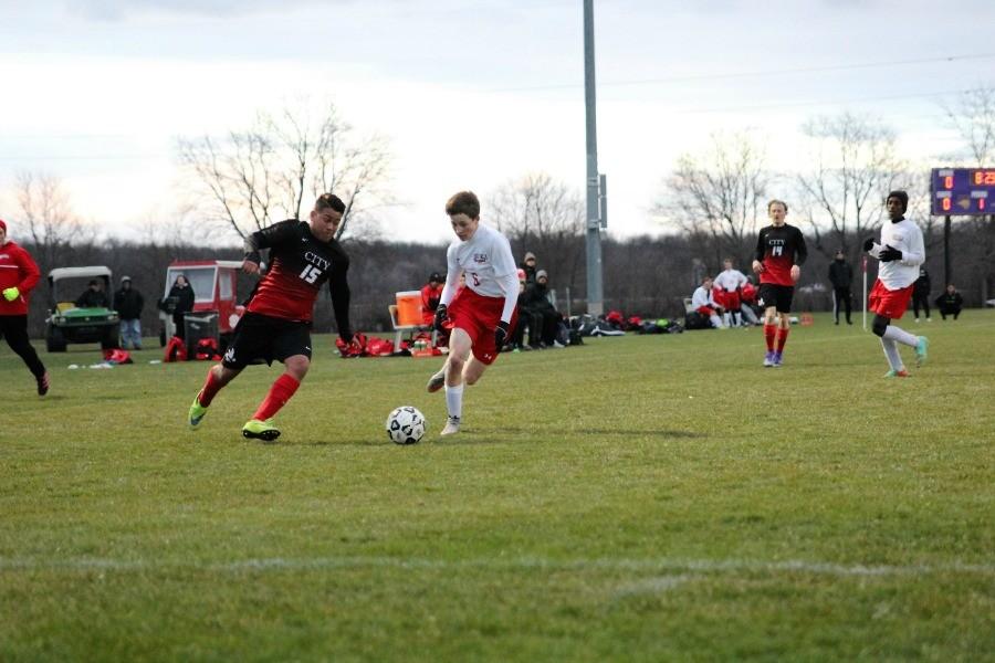 Dennis Espinal 18 works his way around a defender.