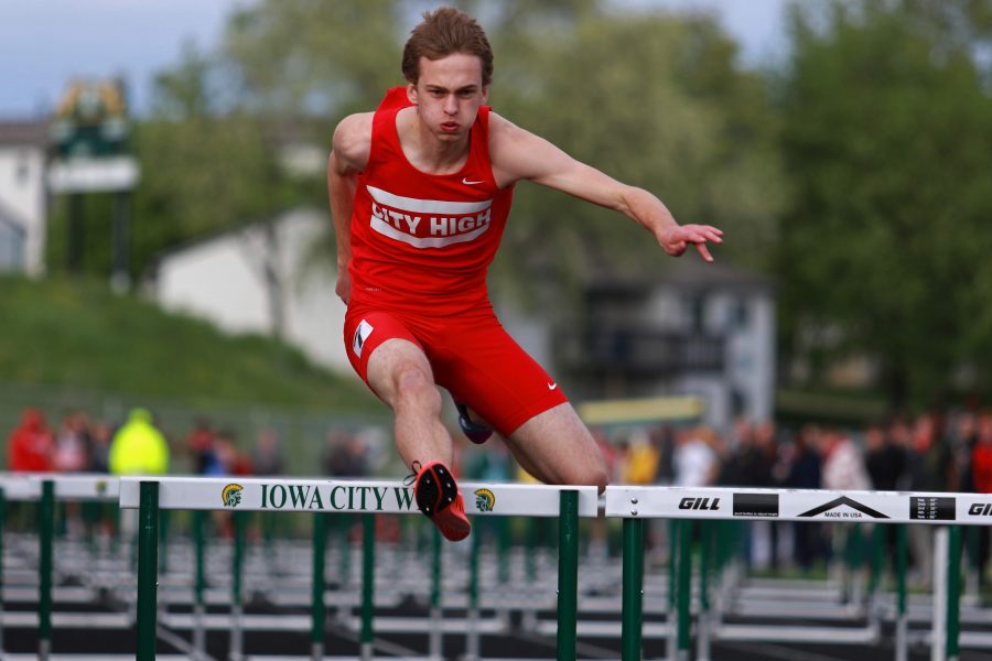 Sy+Butler+16+clears+a+hurdle+on+Thursday%2C+May+12th%2C+2016+at+West+High+in+the+shuttle+hurdle+relay.