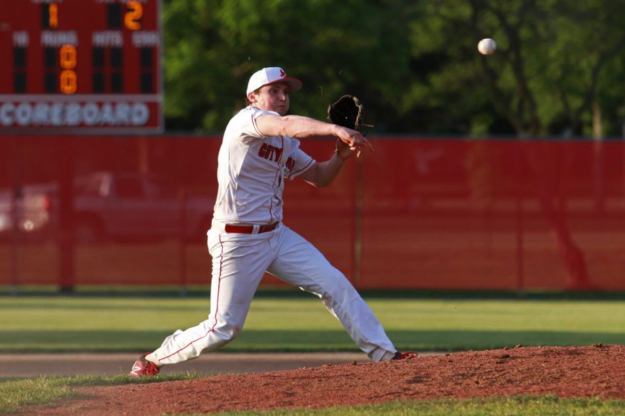 Brett McCleary '17 throws to first base to tag a Davenport West player out on May 23rd, 2016.