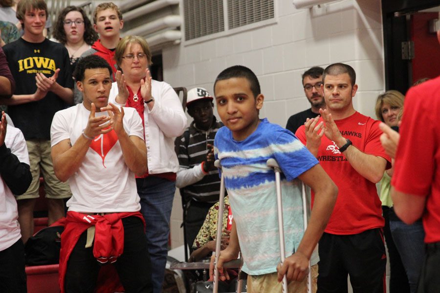 Martin Luna 17 walks into the spring pep assembly as everyone cheered for him. 