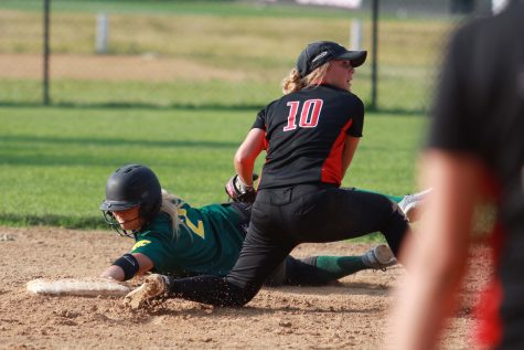 City High second basemen Ellie Grace Dixon 17 looks to an umpire after tagging out a Cougar runner during the Little Hawks doubleheader against No. 2 Cedar Rapids Kennedy at City High on Tuesday, June 14, 2016.