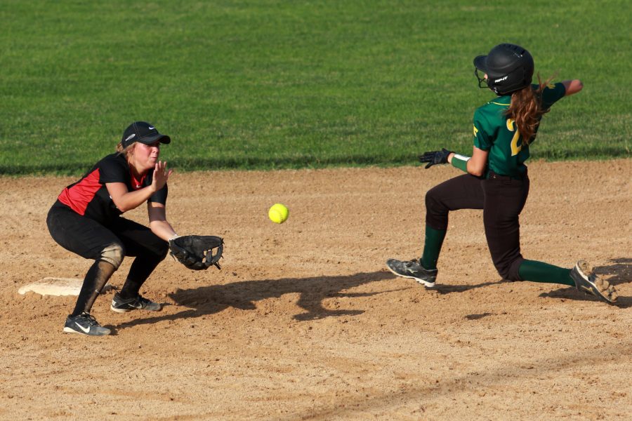 Ellie Grace Dixon 17 attempts to tag out a Cougar runner as they slide into second during City Highs doubleheader against No. 2 Cedar Rapids Kennedy at City High on Tuesday, June 16, 2016.