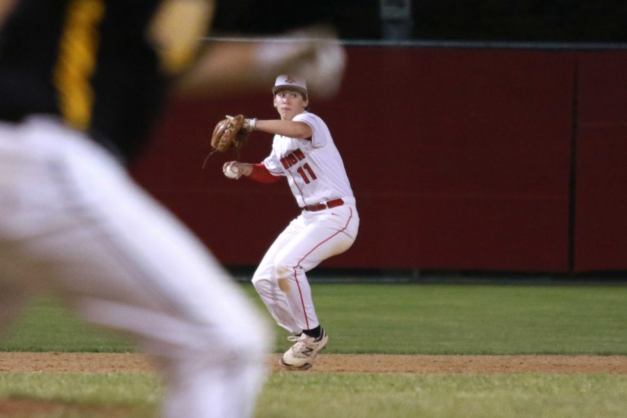 Caleb Sass '17, shortstop, throws to first beating out a Bettendorf player for the out during City High's game against the Bulldogs on Wednesday, June 1st, 2016.