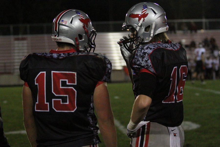 Nate Wieland 17 (#15) and Jared Taylor 17 (#16) talk on the sideline during Citys game against Ames on September 9th. 