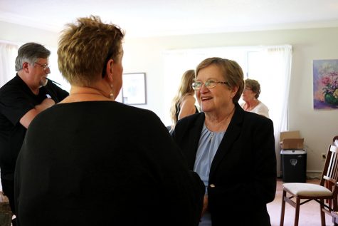 Patty Judge speaks with a supporter at an event in Iowa City on September 24th.