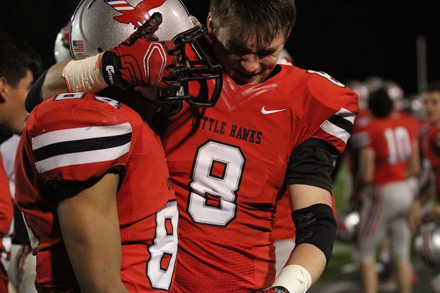 QB+Nate+Weiland+celebrates+after+beating+Muscatine+in+the+homecoming+game.